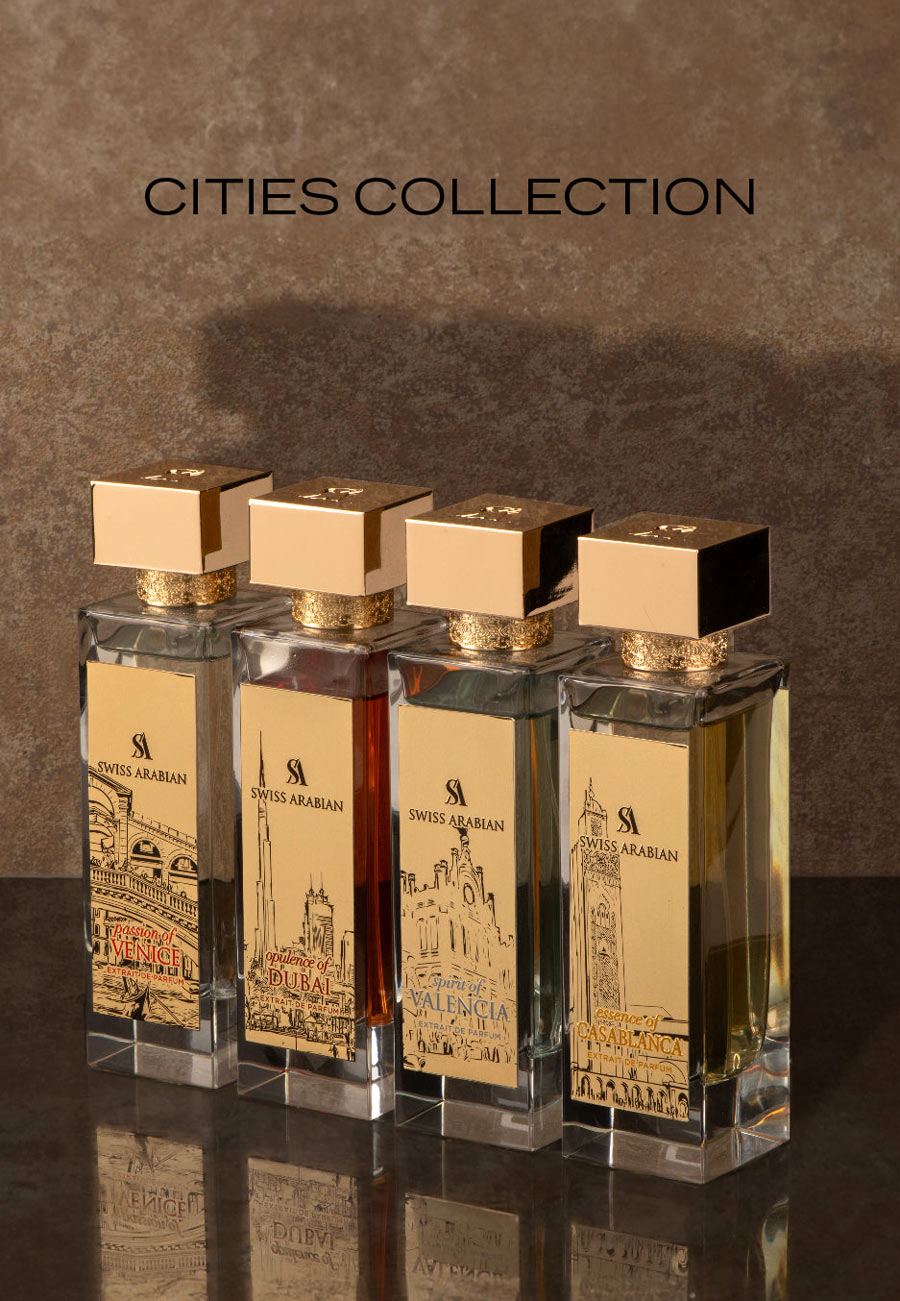Swiss Arabian Cities Collection perfume samples — Venice, Dubai, Valencia and Casablanca in elegant bottles with gold architectural designs.