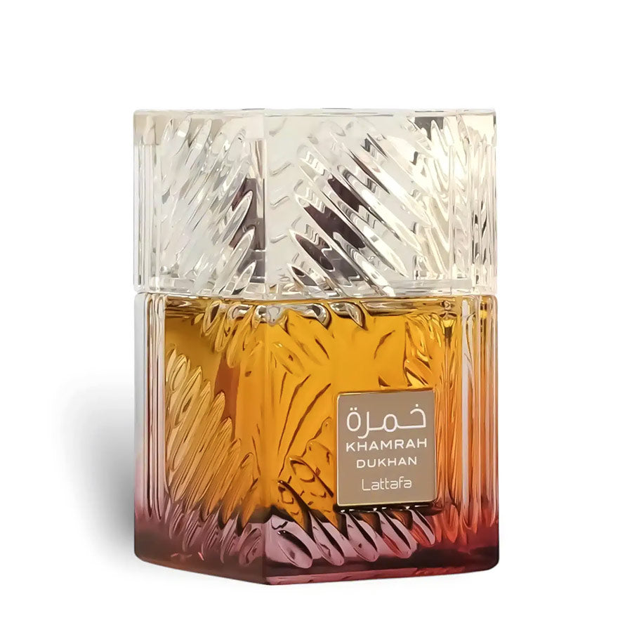 Lattafa Khamrah Dukhan textured glass perfume bottle with an amber-to-red gradient on a white background.
