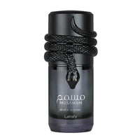 Close-up of Lattafa Musamam Black Intense perfume bottle with black snake design