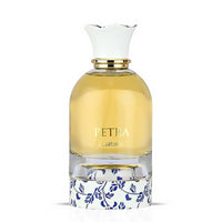 Lattafa Petra perfume bottle with white and blue floral base design on white background