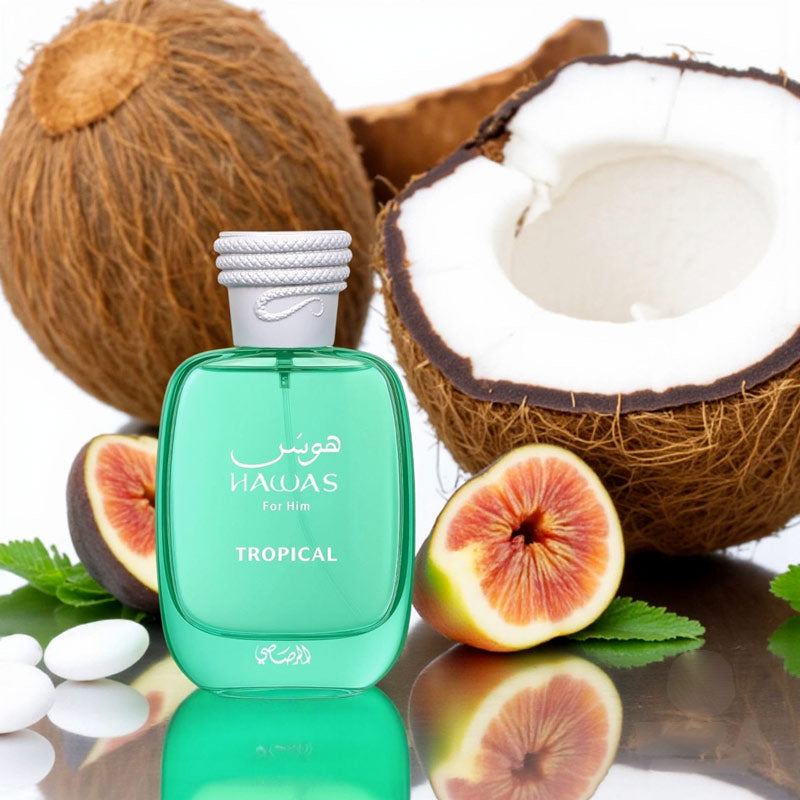 Hawas Tropical for Him by Rasasi perfume bottle surrounded by coconuts, figs, and green tropical leaves.